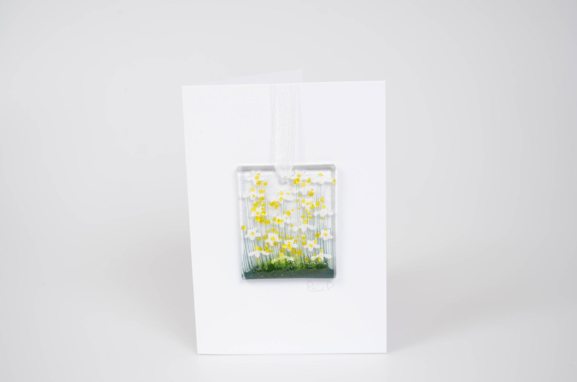 Glass panel with yellow flowers on a white background