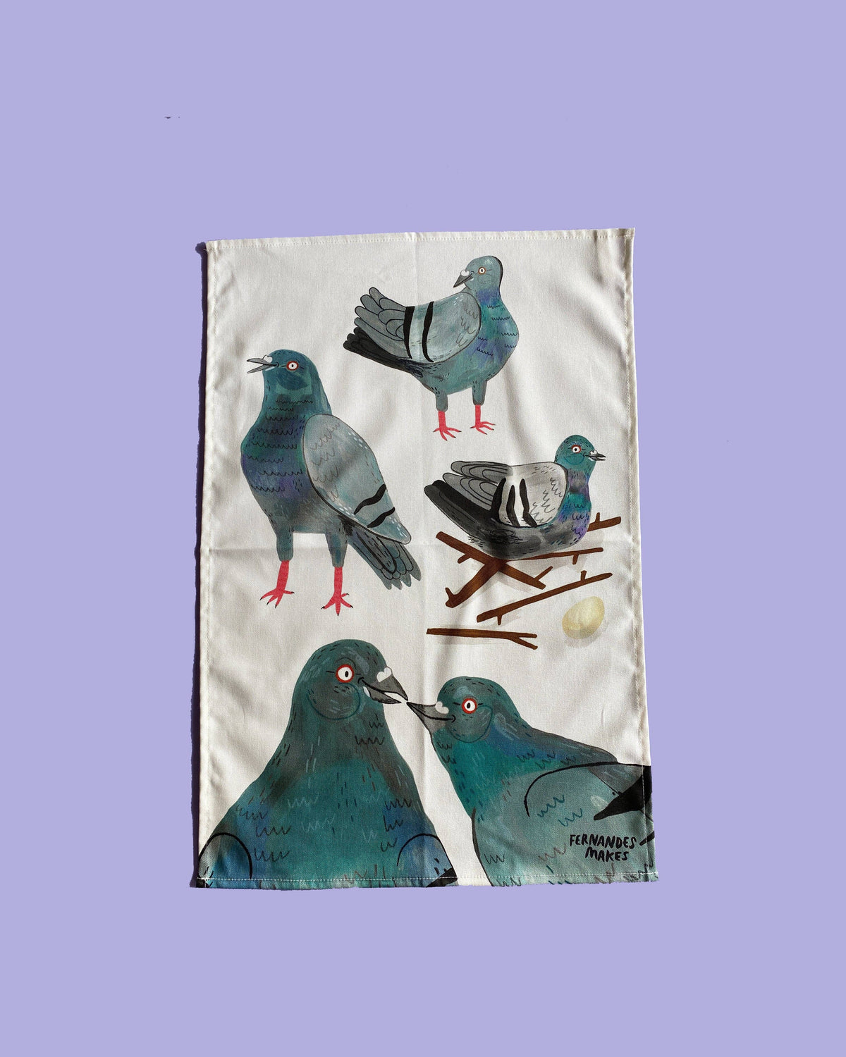 Tea towel with pigeon design on a purple background