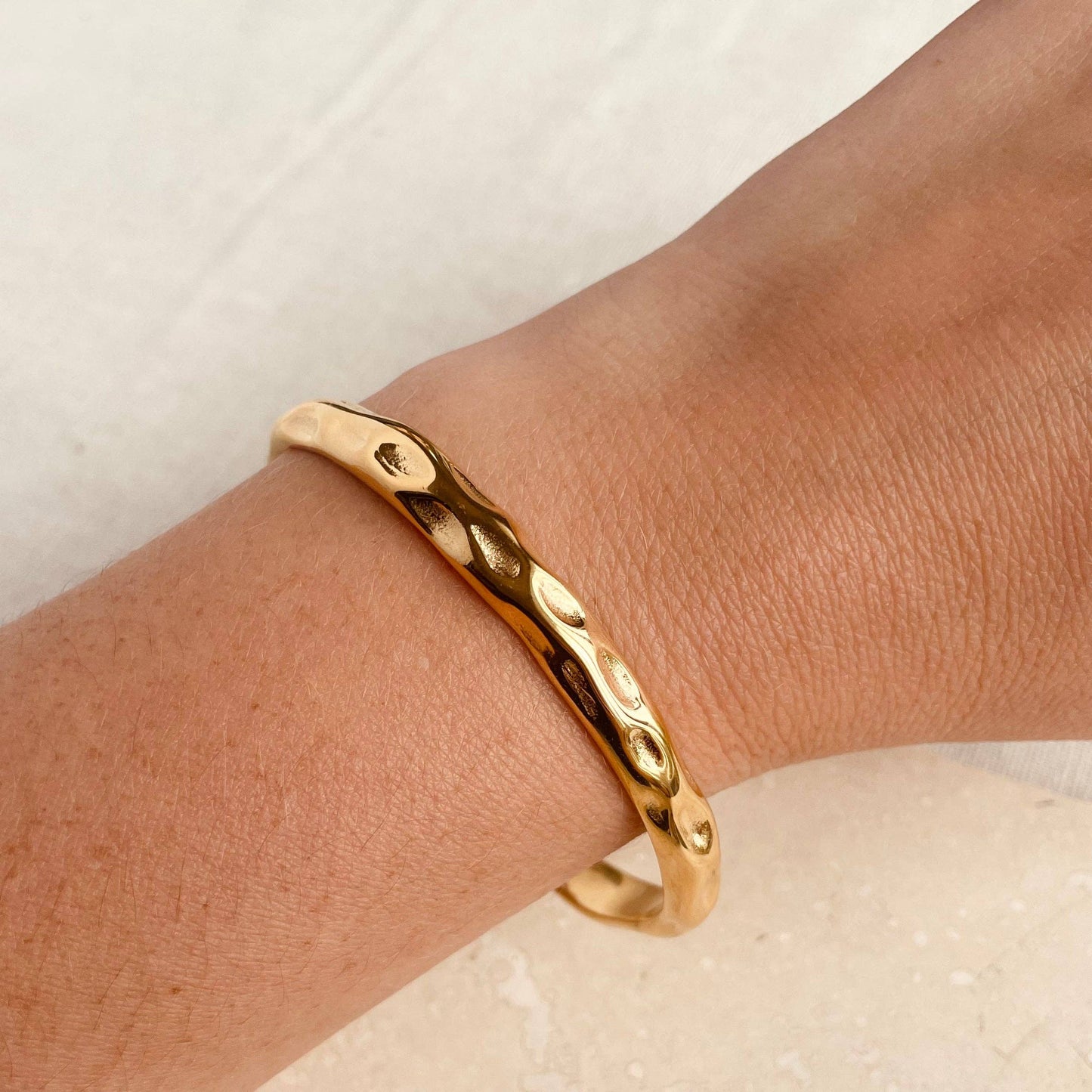 Gold plated hammered bangle