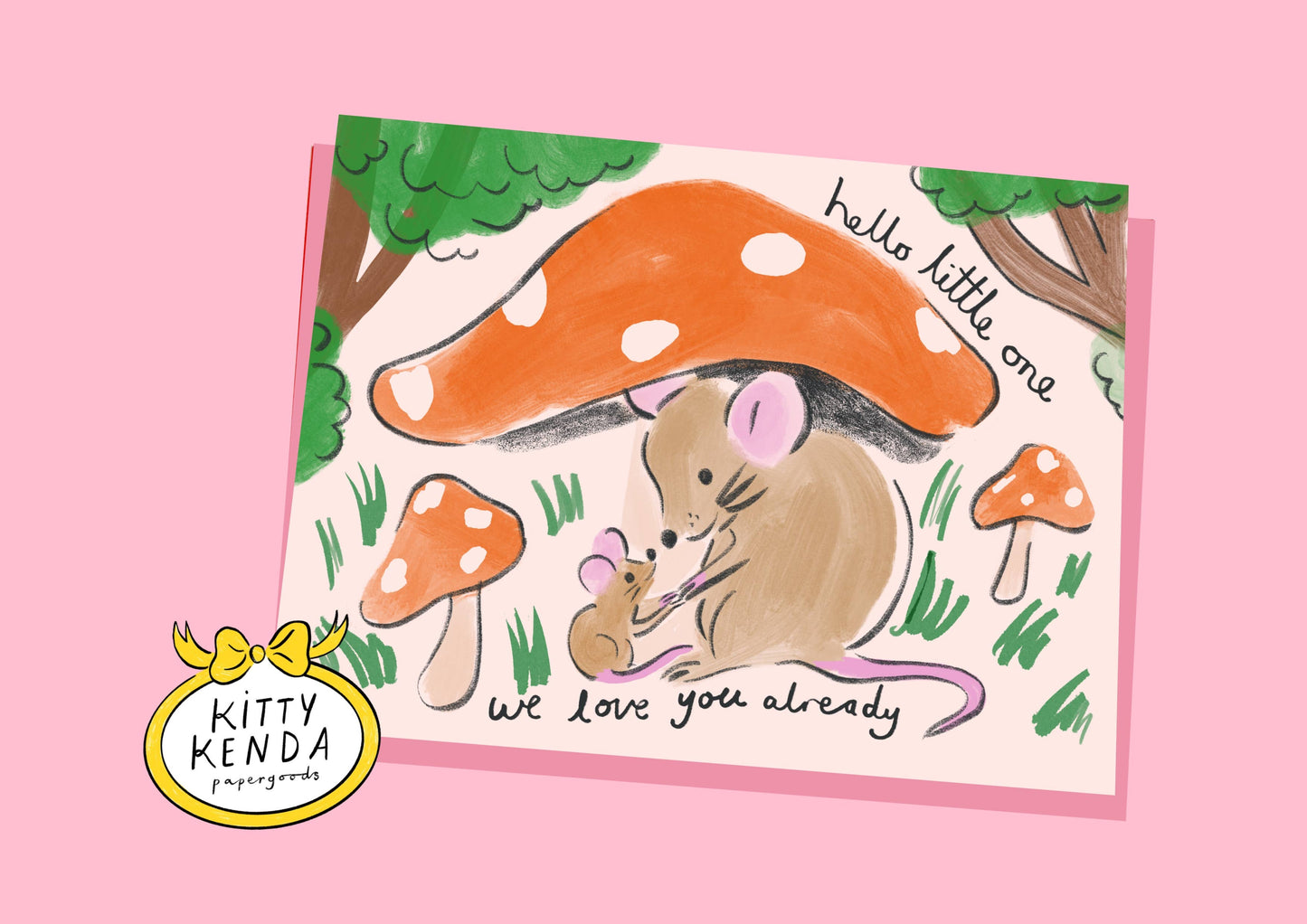 Illustration of a mouse and baby mouse under a large mushroom with 'hello little one' text on a pink background, featuring the Kitty Kenda brand.