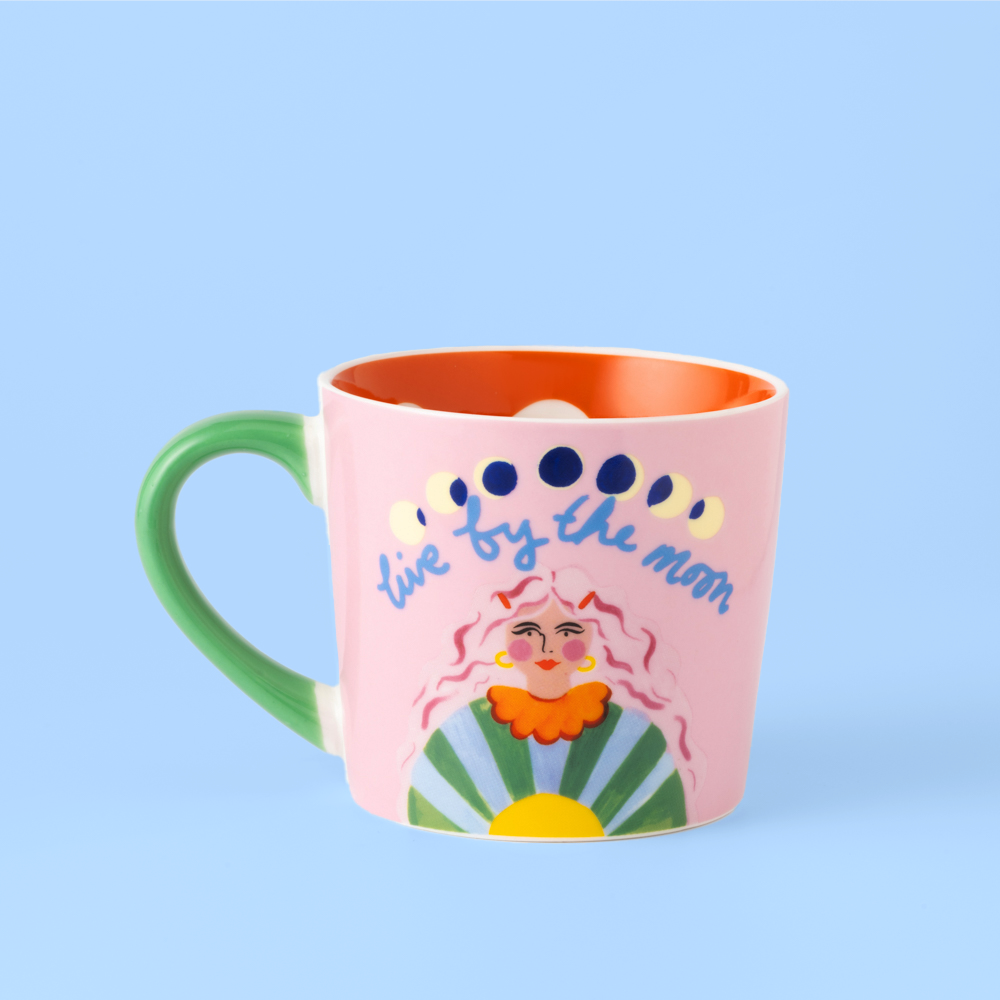 Colorful mug with a design and text on a light blue background