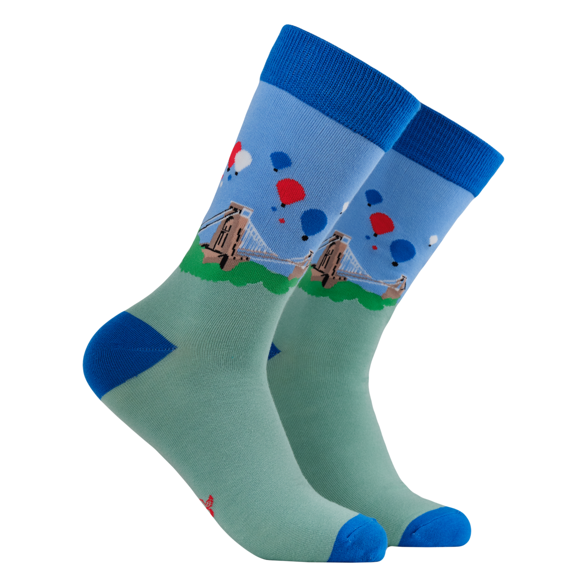 Pair of socks with a design of a bridge and balloons on a white background