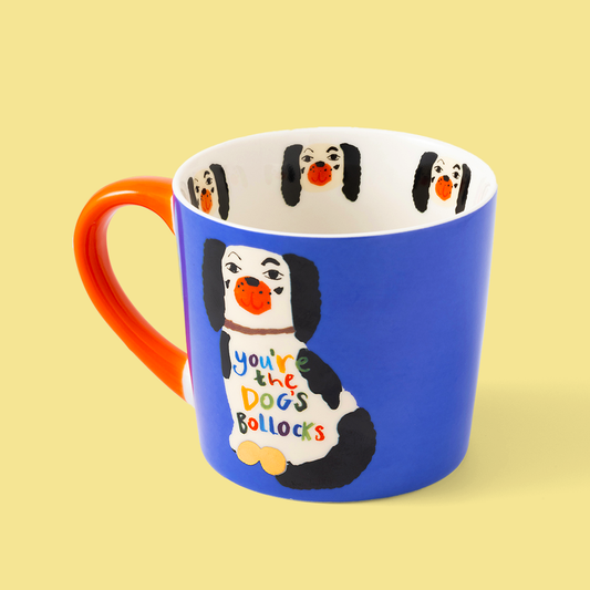 Blue mug with a cartoon dog design and text on a yellow background