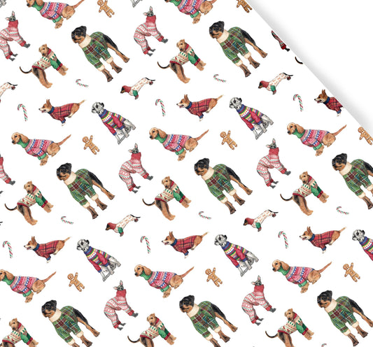 Pattern of dogs wearing Christmas sweaters and pajamas on a white background