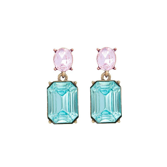 Pair of earrings with pink gemstones and blue rectangular stones on a white background
