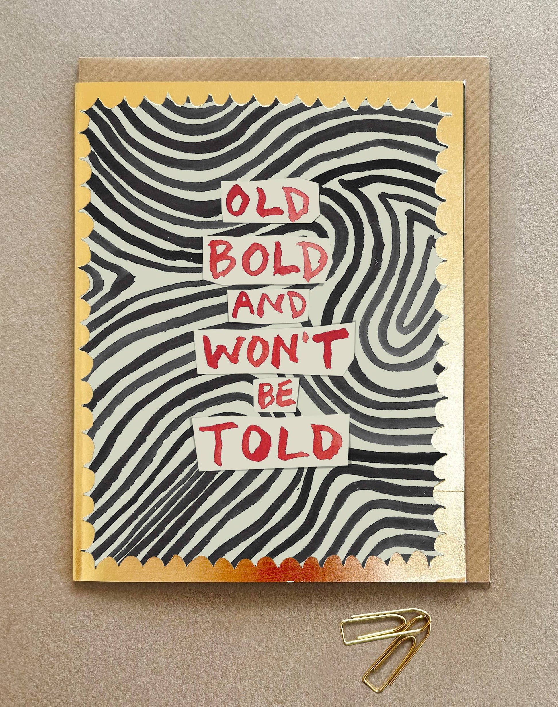 Greeting card with wavy pattern and text 'Old Bold and Won't Be Told' on a beige background