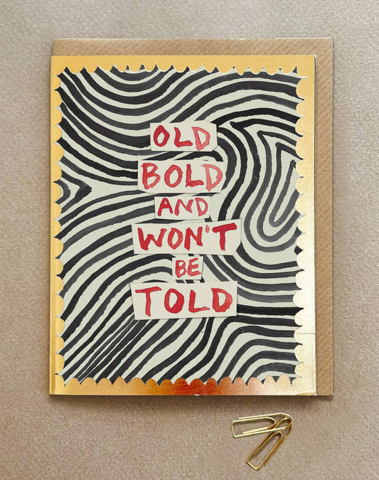 Greeting card with wavy pattern and text 'Old Bold and Won't Be Told' on a beige background