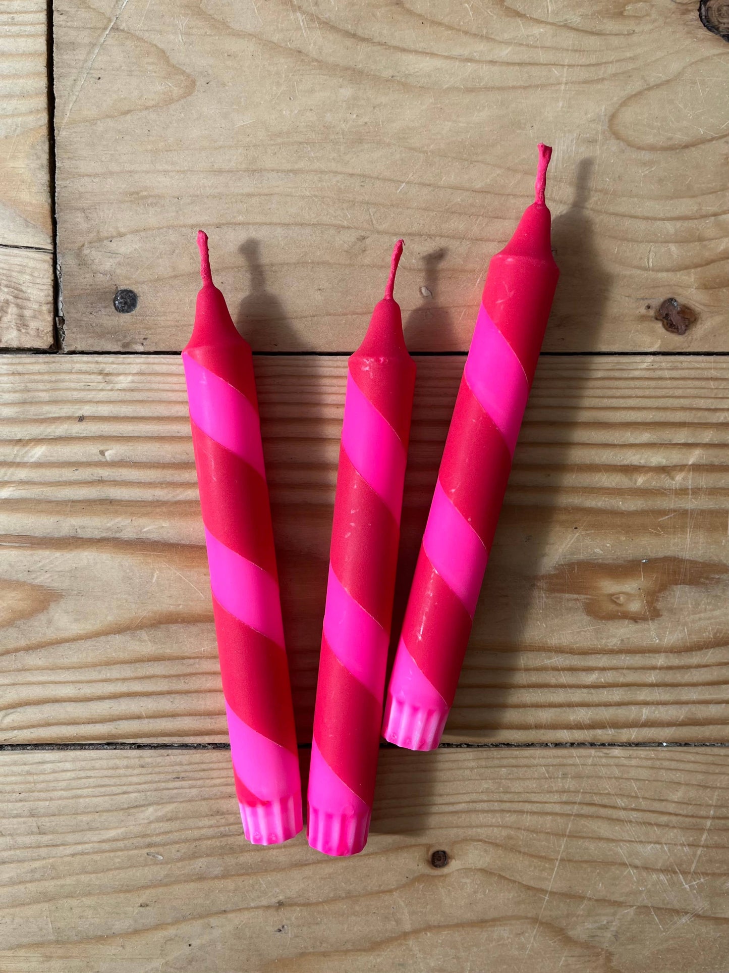 Helter Skelter red and neon pink table candle.