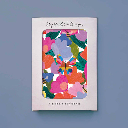 Card set with colorful floral design on a light gray background