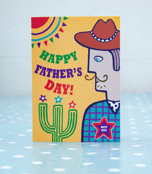 A yellow card with a side view portrait of a cowboy wearing a star badge that reads "Best Dad". To the left of the cowboy is the text "Happy Father's Day!"