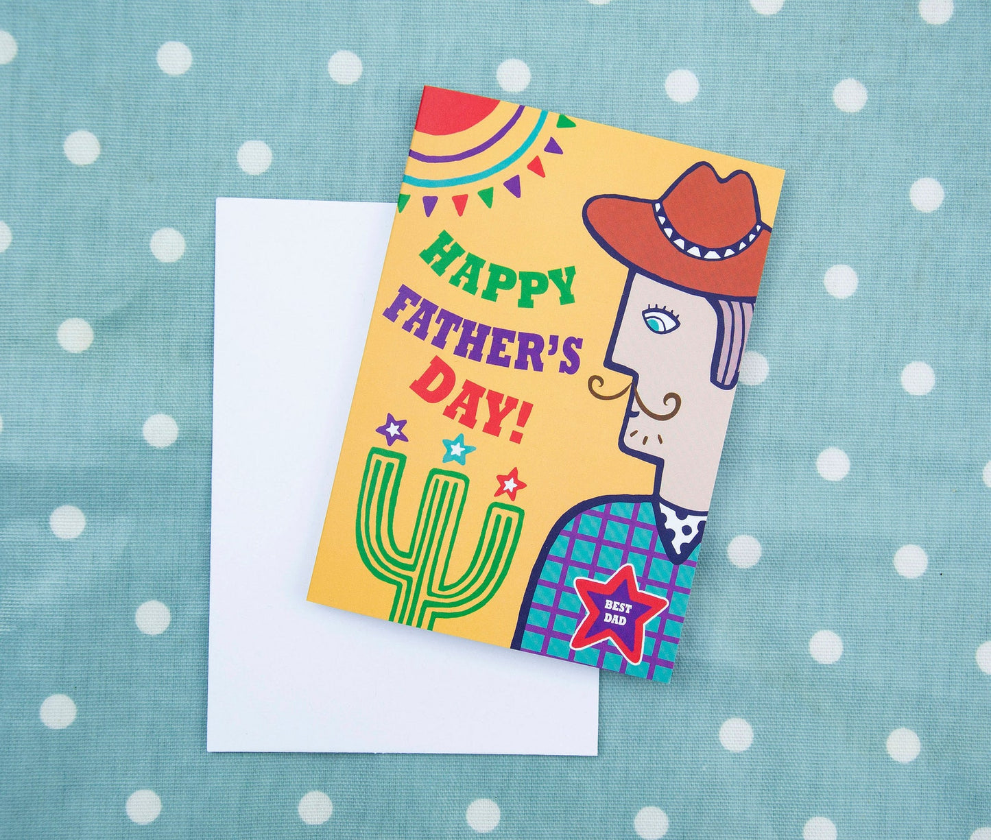 A yellow card with a side view portrait of a cowboy wearing a star badge that reads "Best Dad". To the left of the cowboy is the text "Happy Father's Day!"