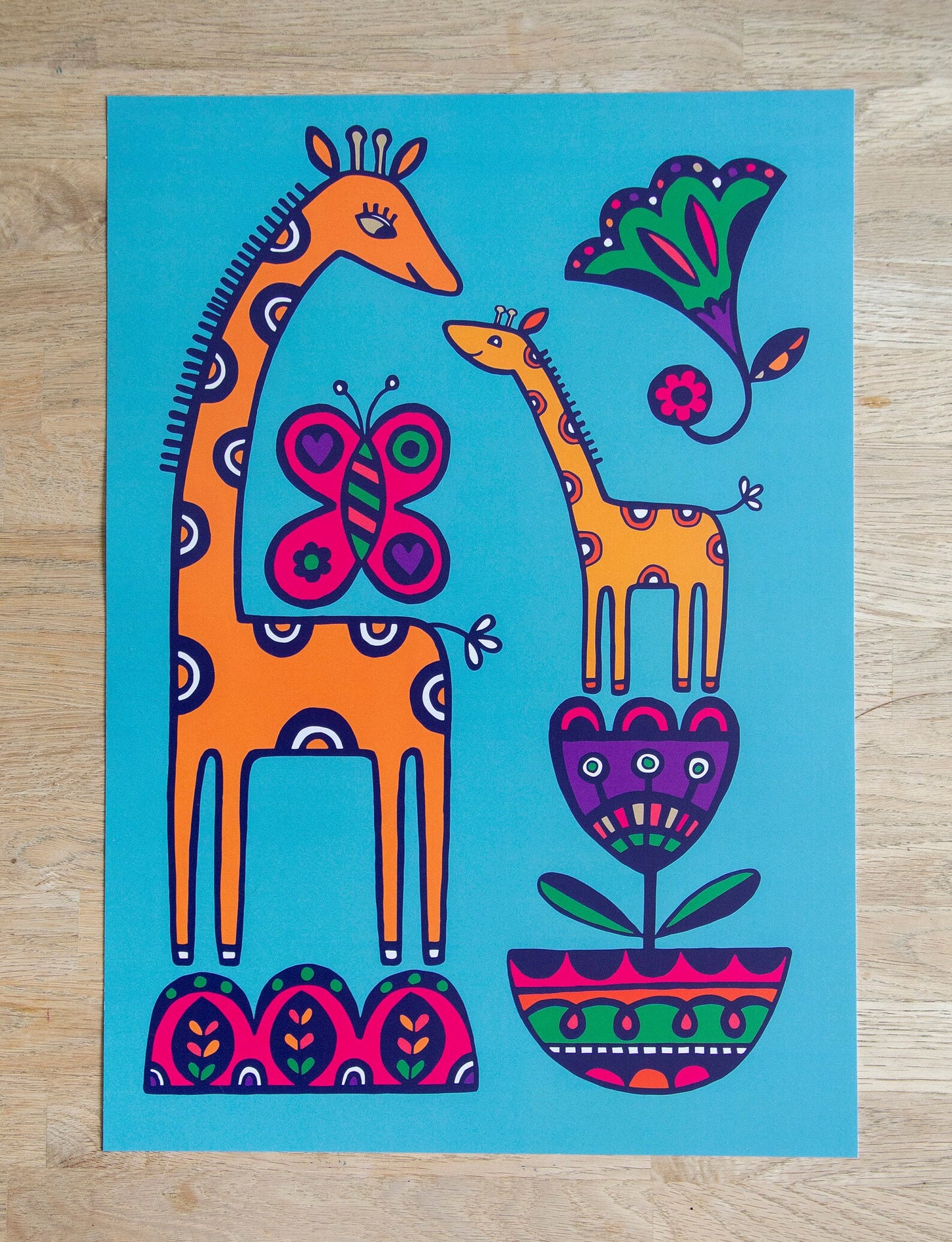 A colourful 2D illustration of a giraffe and baby giraffe surrounded by art deco flowers and large butterfly.