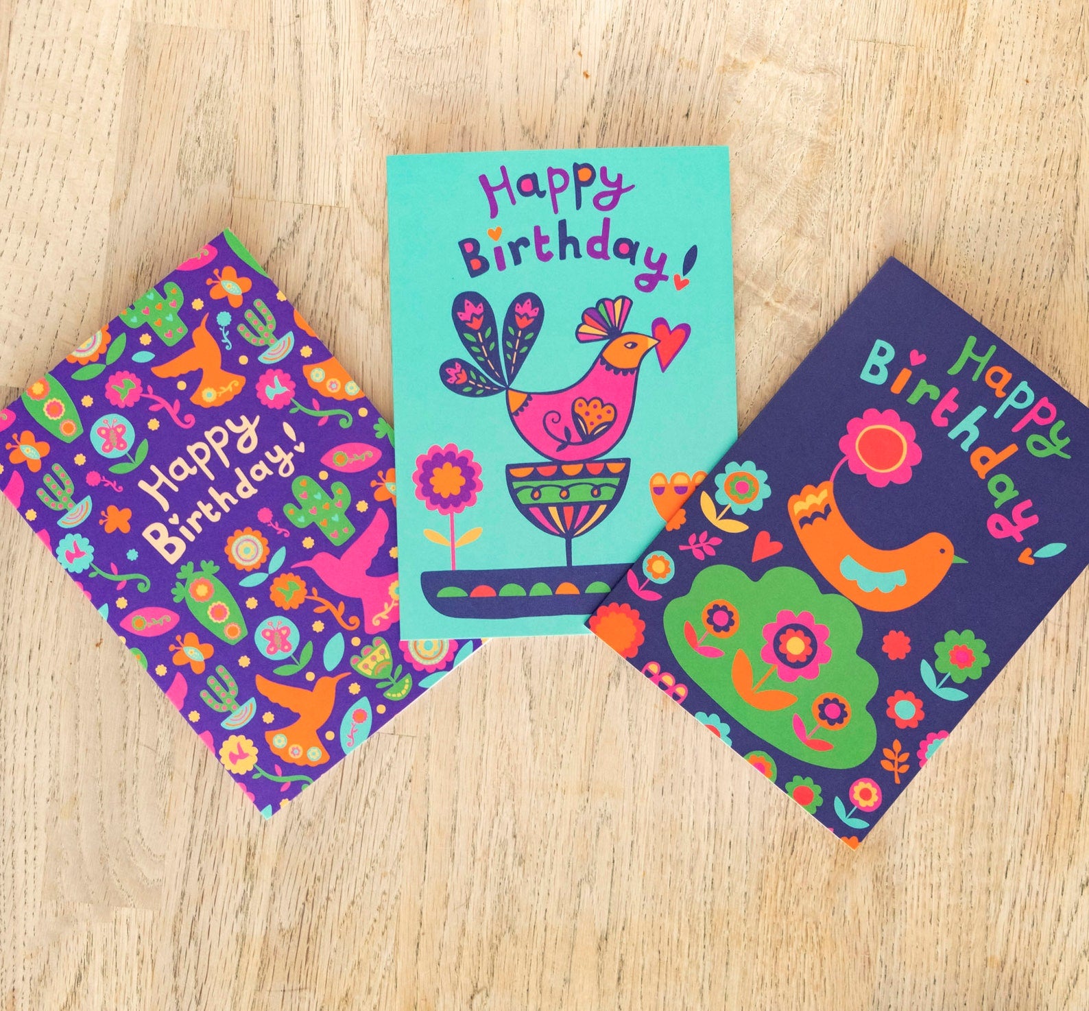 Three birthday cards featuring brightly coloured Mid Century Mexican inspired flora and bird designs.