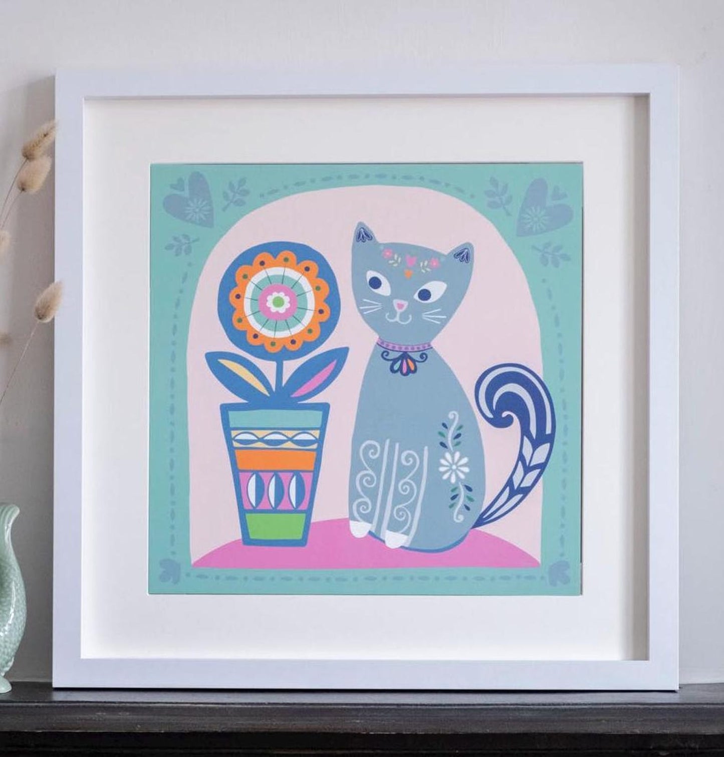 A 2D illustration of a grey cat with decorated with swirly patterns, next to a bright and colourful flower pot.