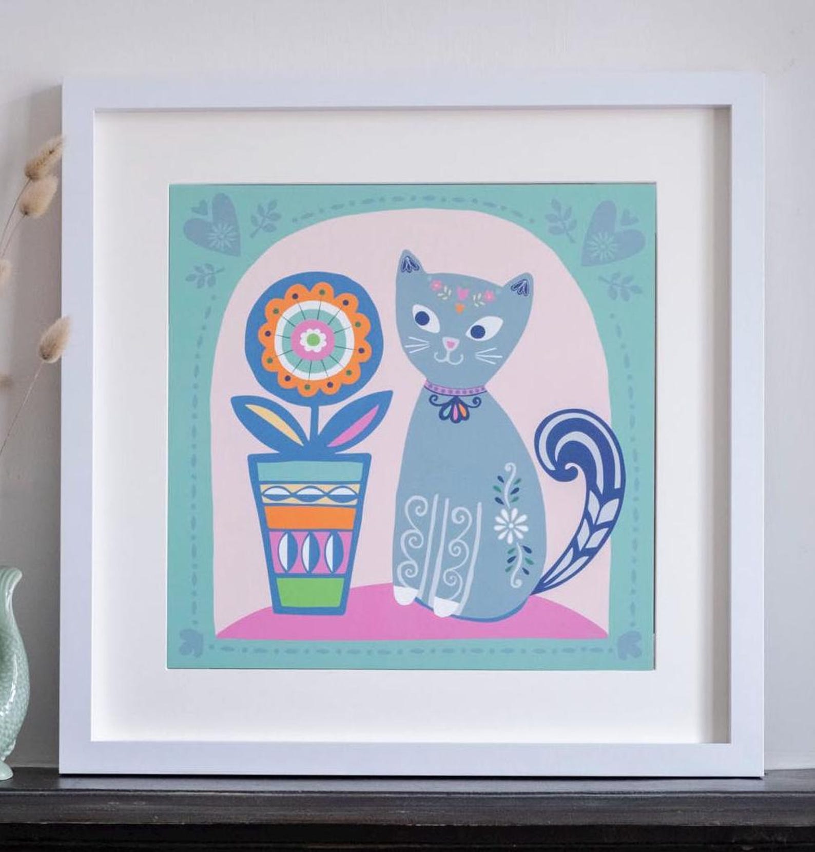 A 2D illustration of a grey cat with decorated with swirly patterns, next to a bright and colourful flower pot.