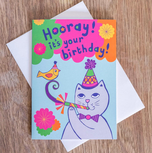 A card depicting a grey cat and yellow bird with party accessories, with the text "Hooray! It's your birthday!" above.