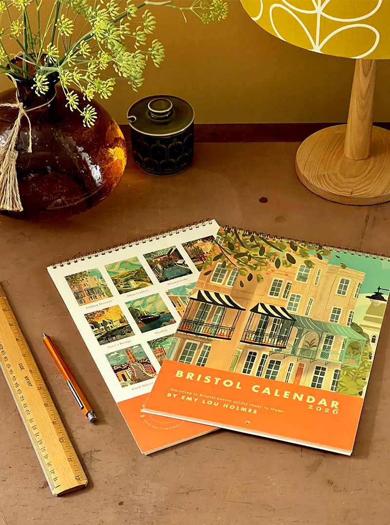 Bristol calendar 2023 on a wooden surface with decorative items