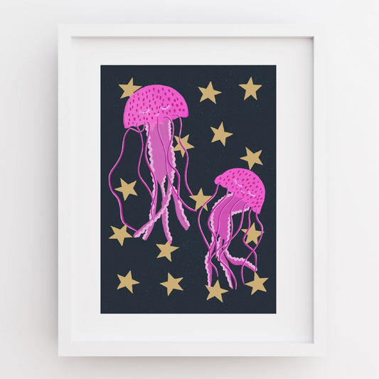 Framed artwork with pink jellyfish and gold stars on a dark blue background