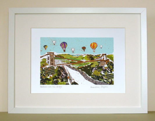 Vibrant collage prints of Bristol Suspension Bridge with balloons flying overhead.