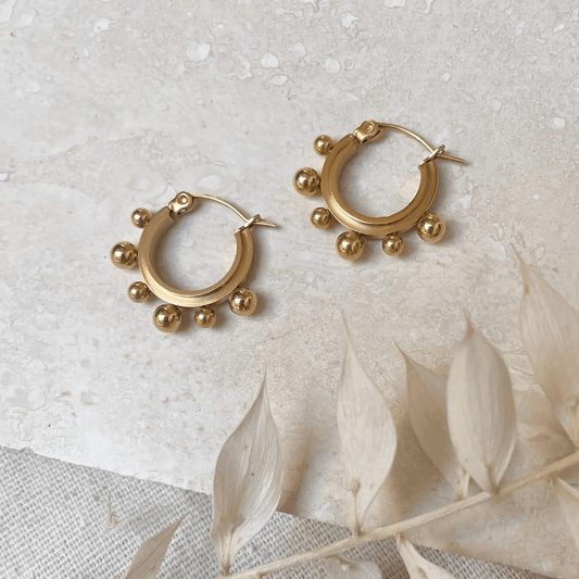 18k Gold Plated Ball Hoop Earrings, on a neutral background, simple minimalist design