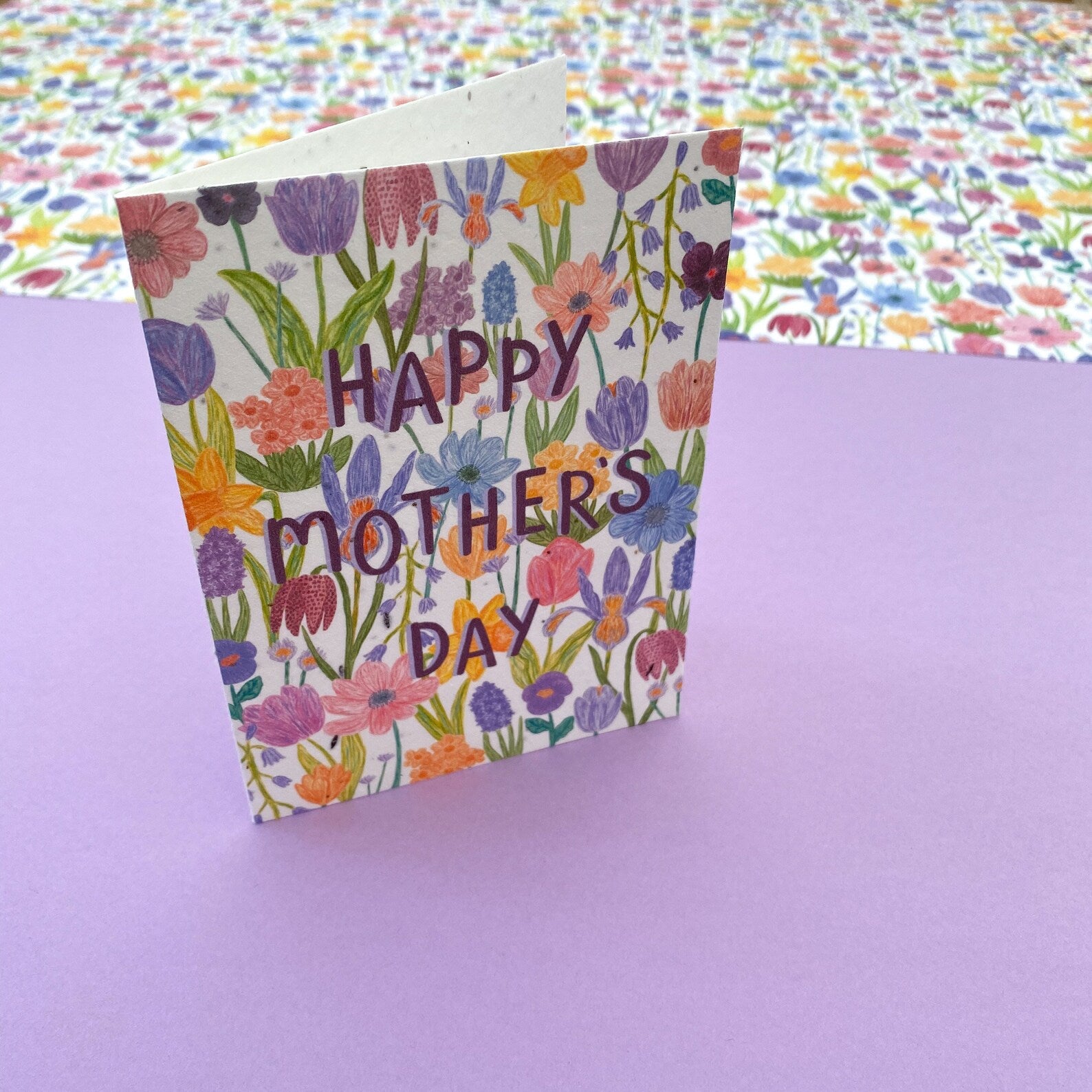 Mothers Day Cards with spring flower illustration covering card and printed on seed embedded paper.
