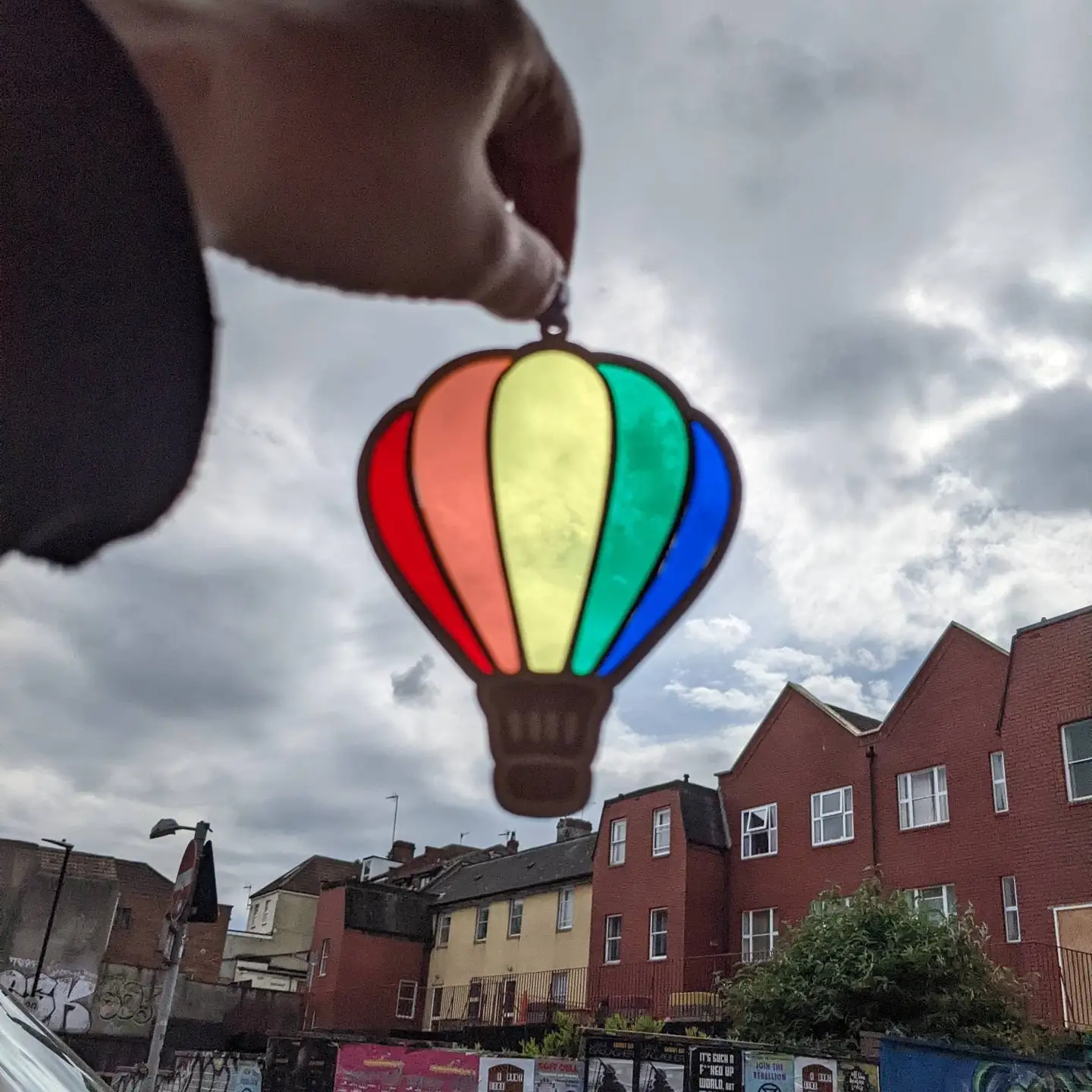 Laser cut balloon with 5 different acrylic colours to create a rainbow hanging