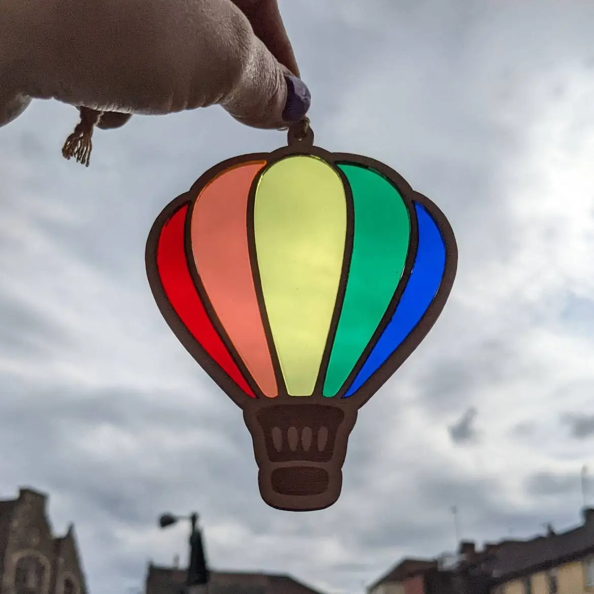 Laser cut balloon with 5 different acrylic colours to create a rainbow hanging