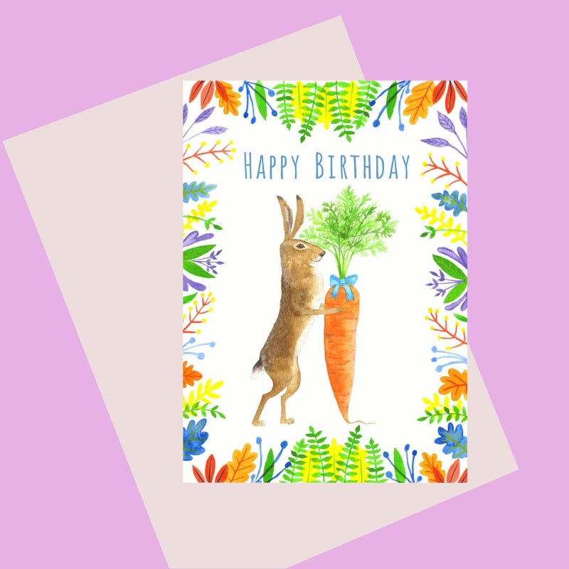 Birthday card with illustration of rabbit with big carrot