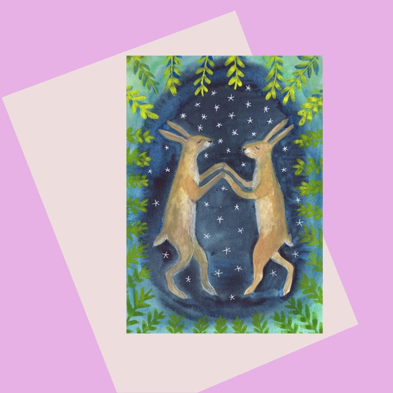 Card with illustration of two hares dancing under the stars