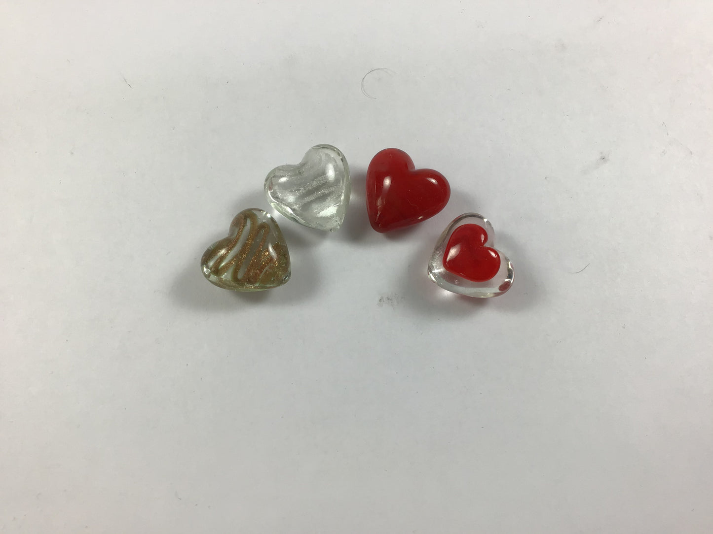 Glass Heart tokens made with a mould. Measuring 2.5 cm. A perfect token to show your love for someone.