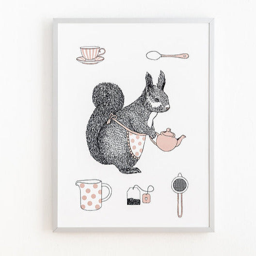 Squirrel in apron holding teapot. Jug, tea cup, teabag and spoon in background