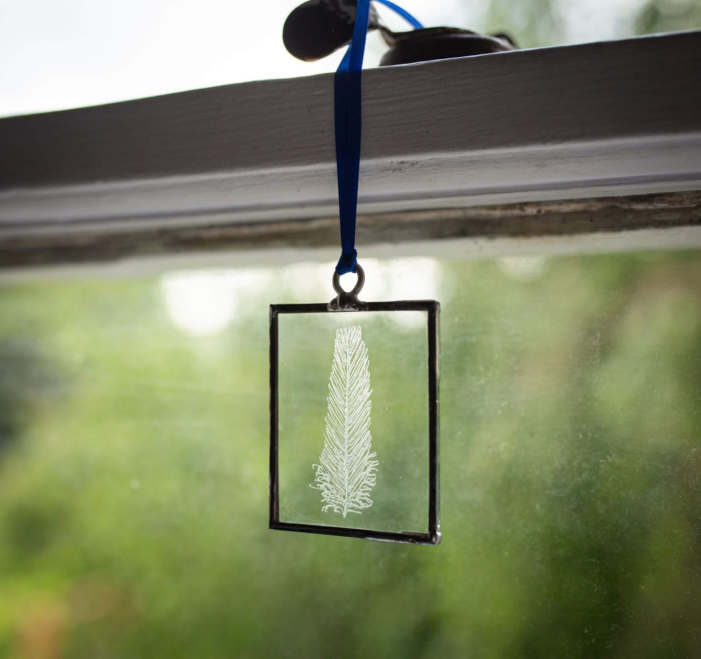The Corbeau Press Feather Hanging