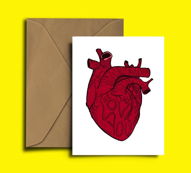 Glass Designs Dixon Does Doodles card with a picture of a red heart organ and love you written in the veins. 