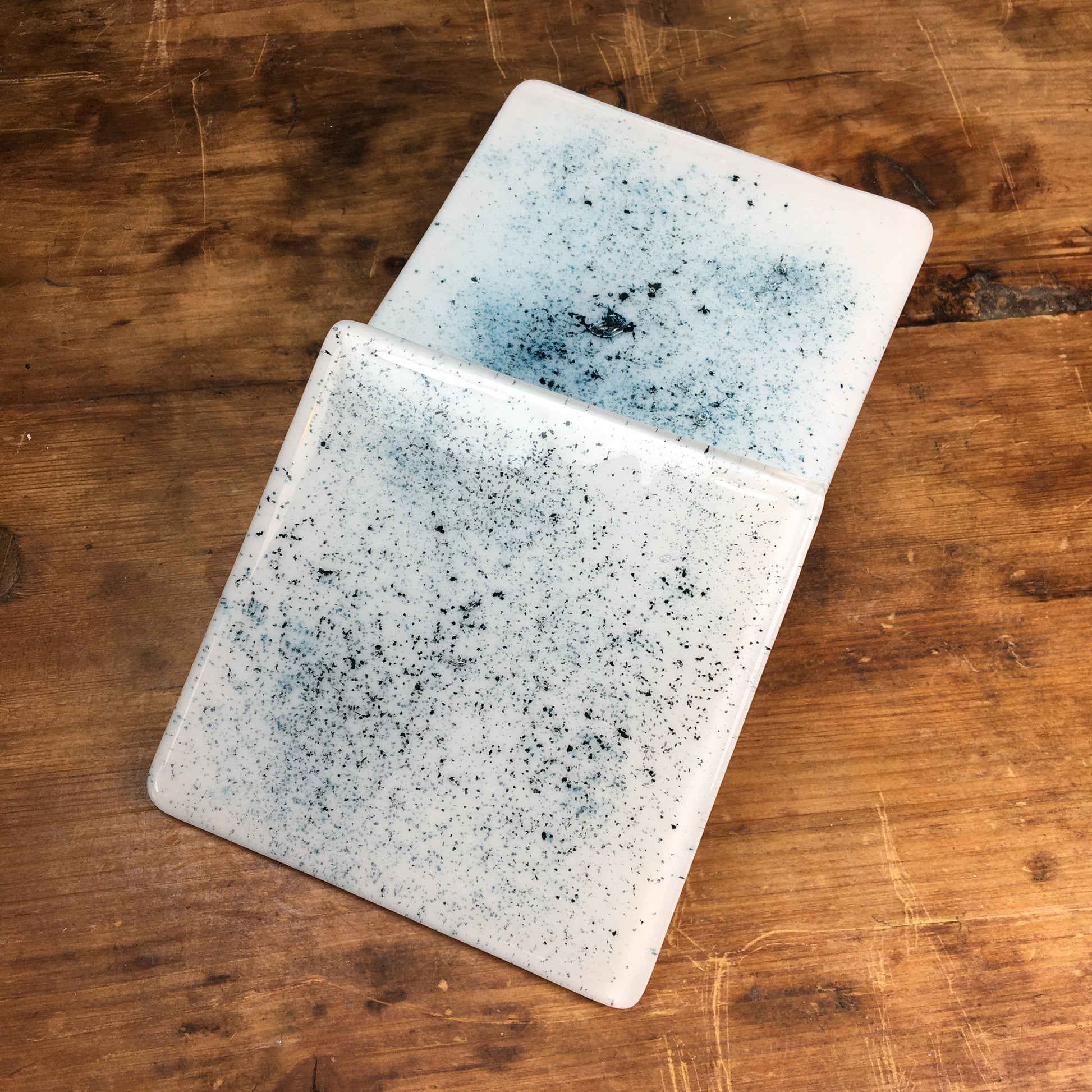 Dadswell Glass, Handmade fused glass coasters, copper oxide powder between glass creating an aqua spray of colour. Beautiful coasters to adorn your home. Made at Glass Designs a Bristol Gift shop.  