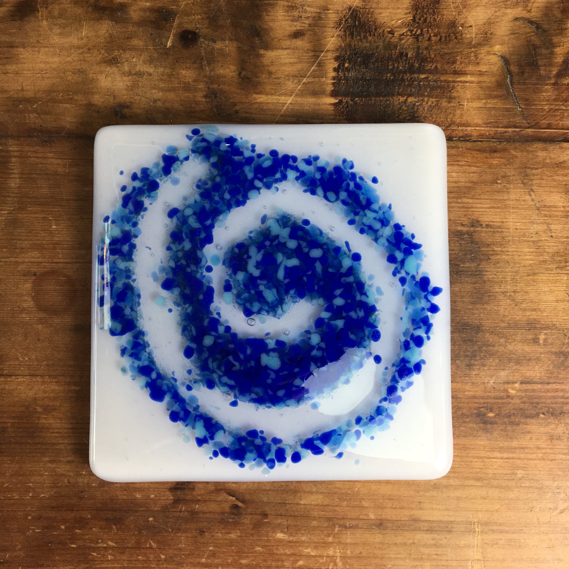 Bristol Blue and light blue swirl on glass coaster. A handmade glass coaster made at Glass Designs a Bristol gift shop.