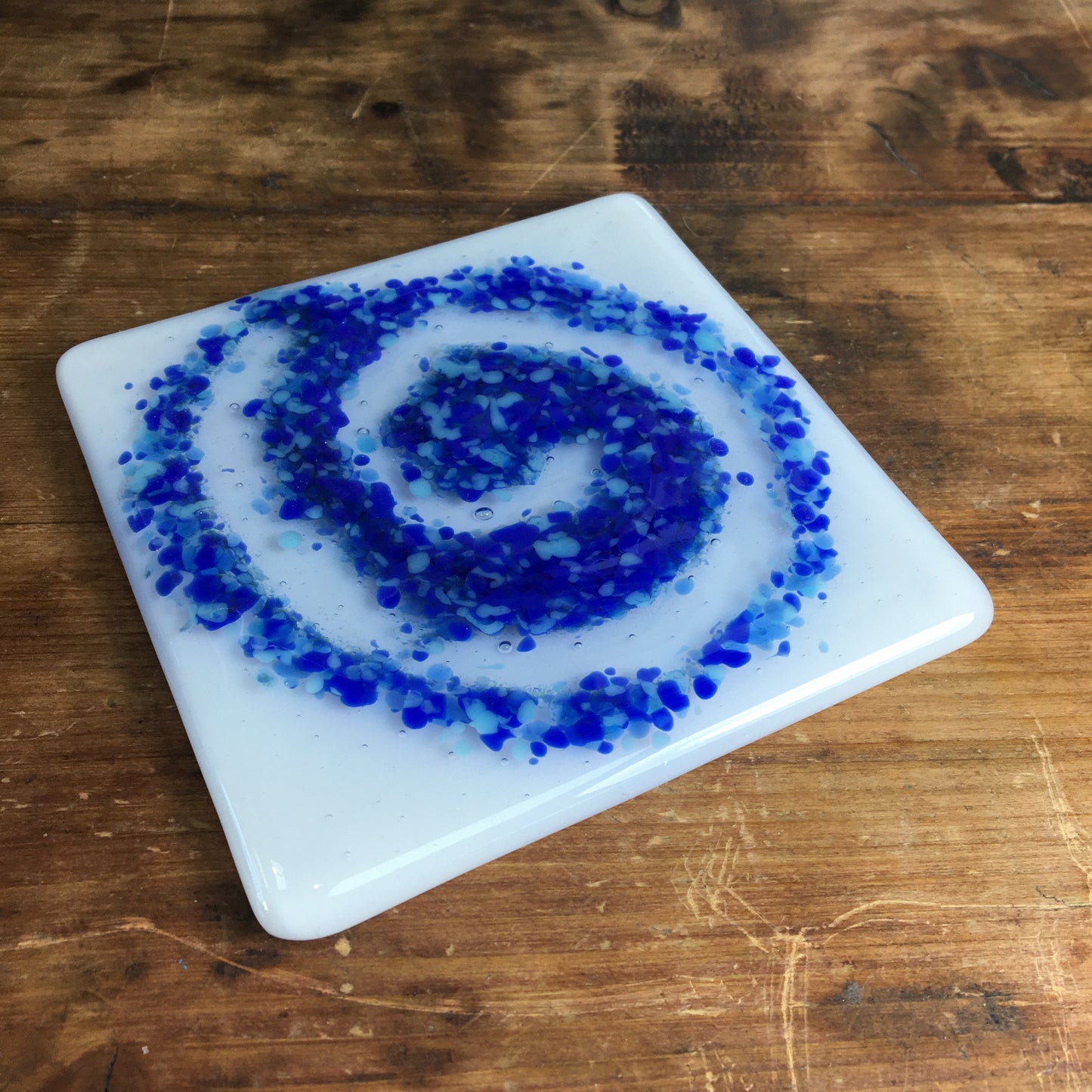 Bristol Blue and light blue swirl on glass coaster. A handmade glass coaster made at Glass Designs a Bristol gift shop.