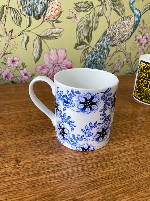 Relentless Optimism bone china mug. Made in Bristol by Stokes Croft China.
