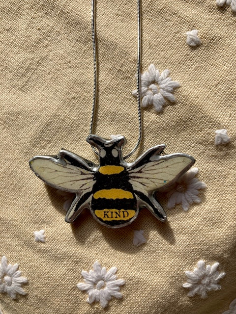 Bumble bee pendant, made from layered paper., metal and resin.  Handmade in Cardiff.