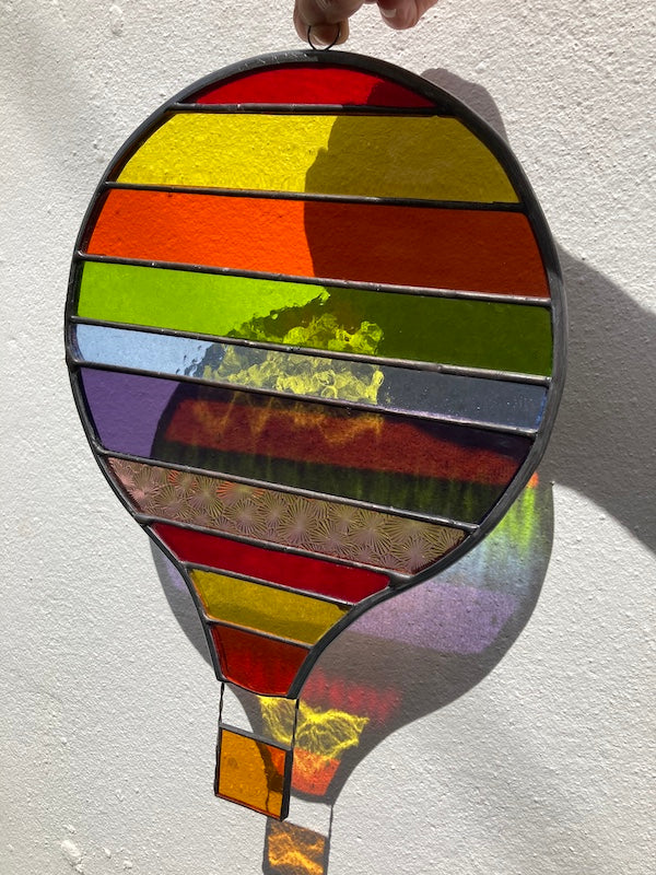 Stained Glass Rainbow Striped Hot Air Balloon, made Dadswell Glass at Glass Designs a Bristol Gift shop.