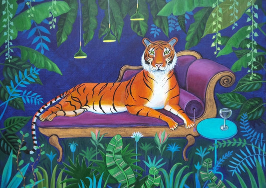 Tiger on a chaise longe surrounded by foliage