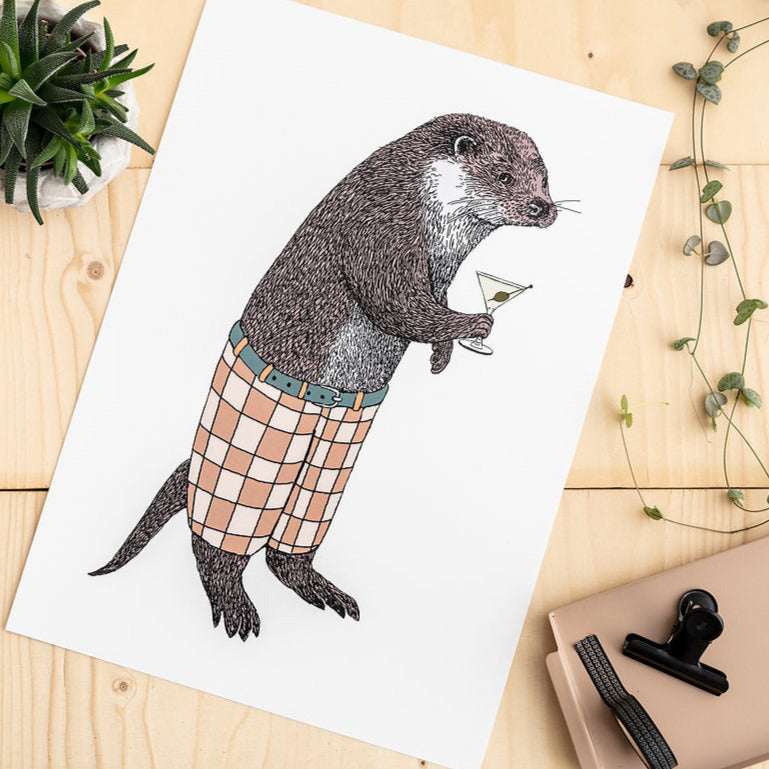 Otter in shorts with a Martini