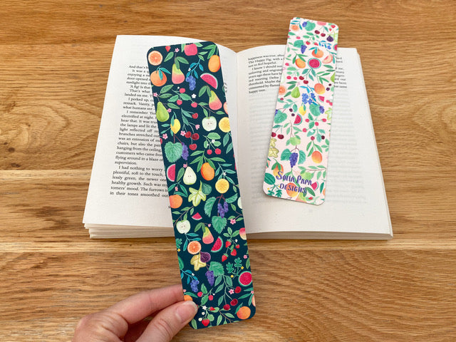 Colouful bookmark with summer fruits. Background dark one side and light the other