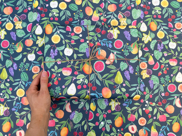 Wrapping paper with colourful summer fruits on dark blue background
