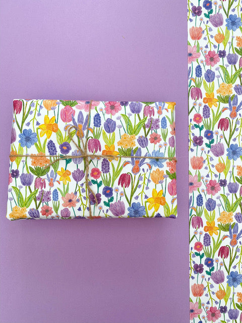 Wrapping paper with colourful flowers on white background