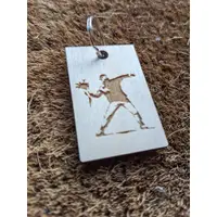 Famous Banksy images laser cut in wood keyring