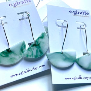 E giraffe green marble like resin earrings.
