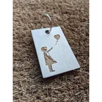 Famous Banksy images laser cut in wood keyring