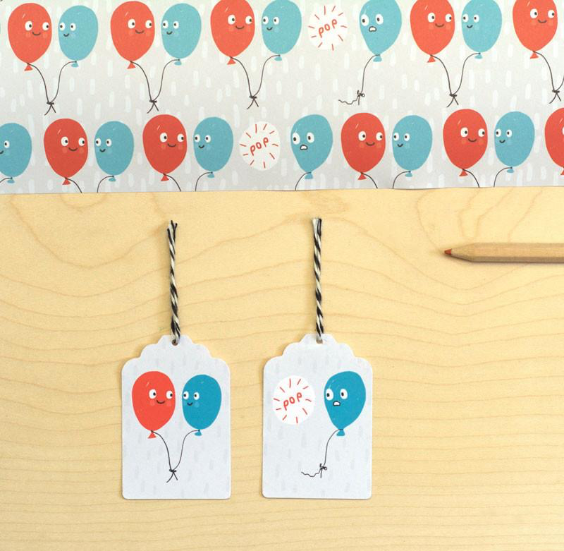 Sarah Ray Whimsical Wrapping Paper.  Blue and Red Party Balloons with smiling faces.  Suitable for Birthday and Celebrations.