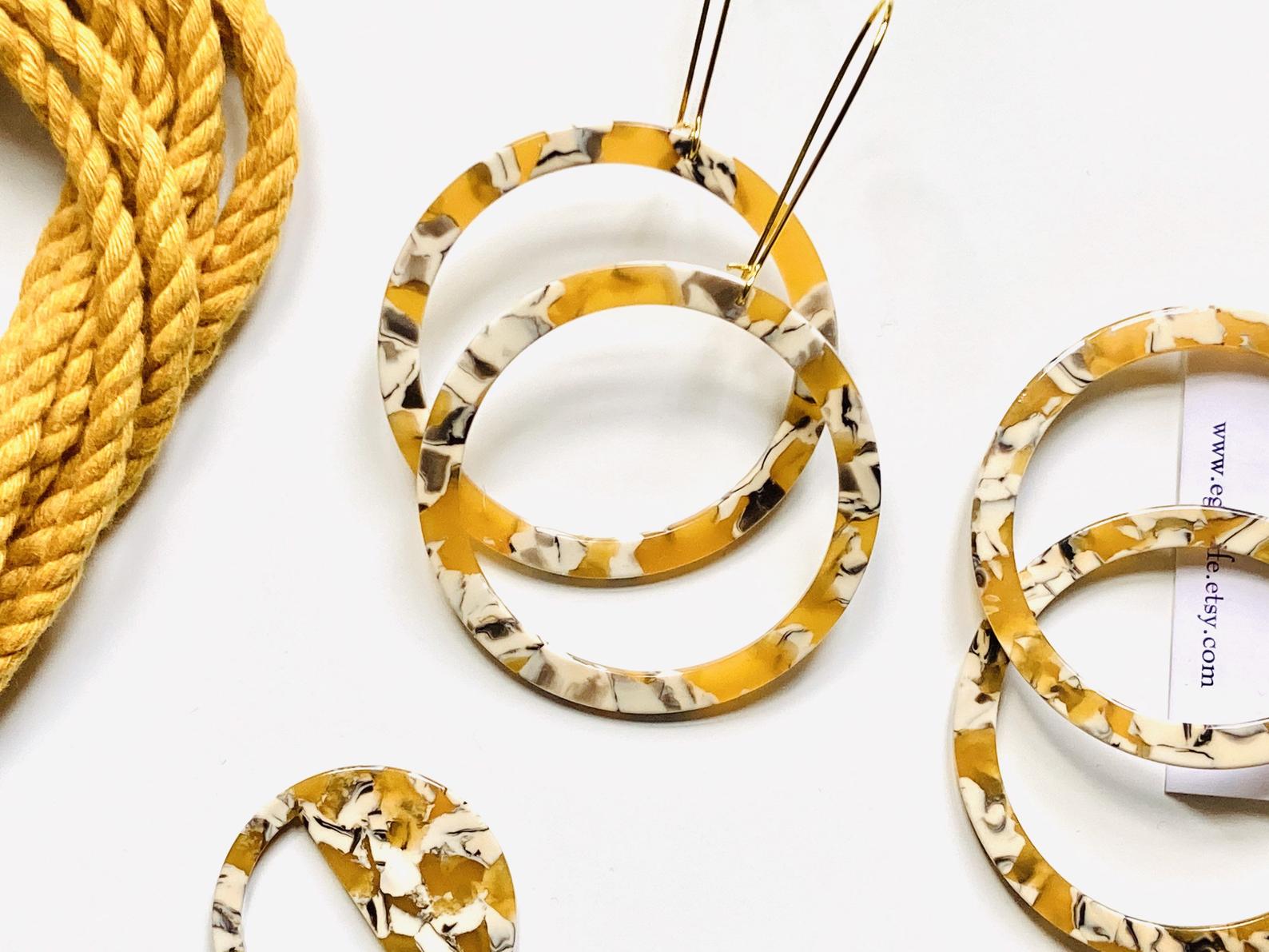 Large resin hoops on long silver plated hoops.