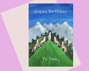 Birthday card with a pack of wolves howling on a mountain